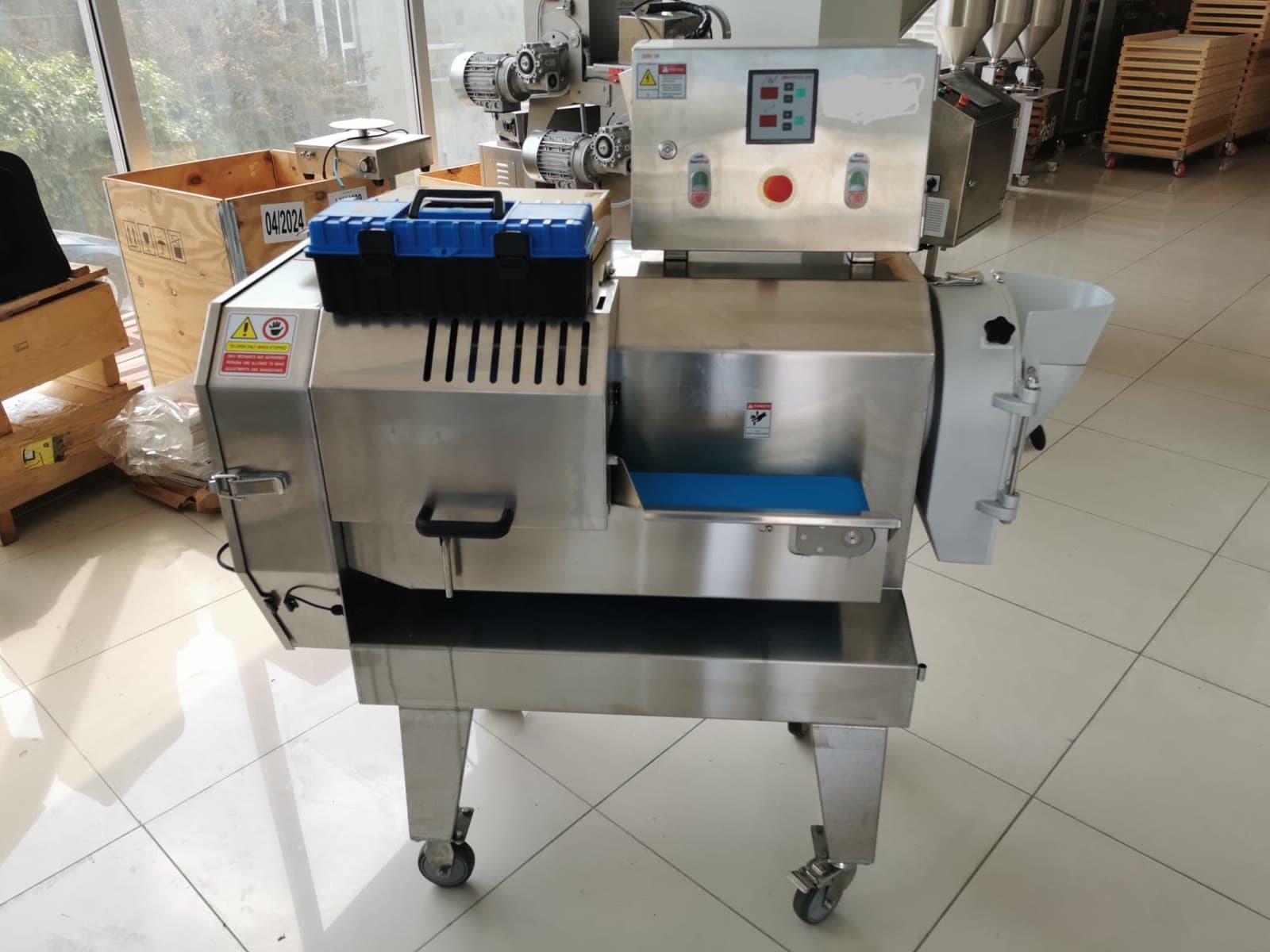 DOKTEK slicing and dicing line, front view with feed hopper, conveyor and control panel